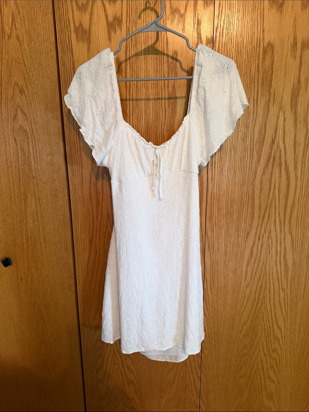 Shyanne White Eyelet Short Dress with Flutter Sleeves. Size medium.